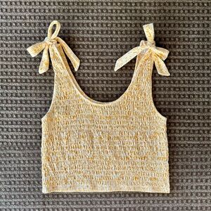 Yellow floral print stretchy tank top with adjustable shoulder ties/bows